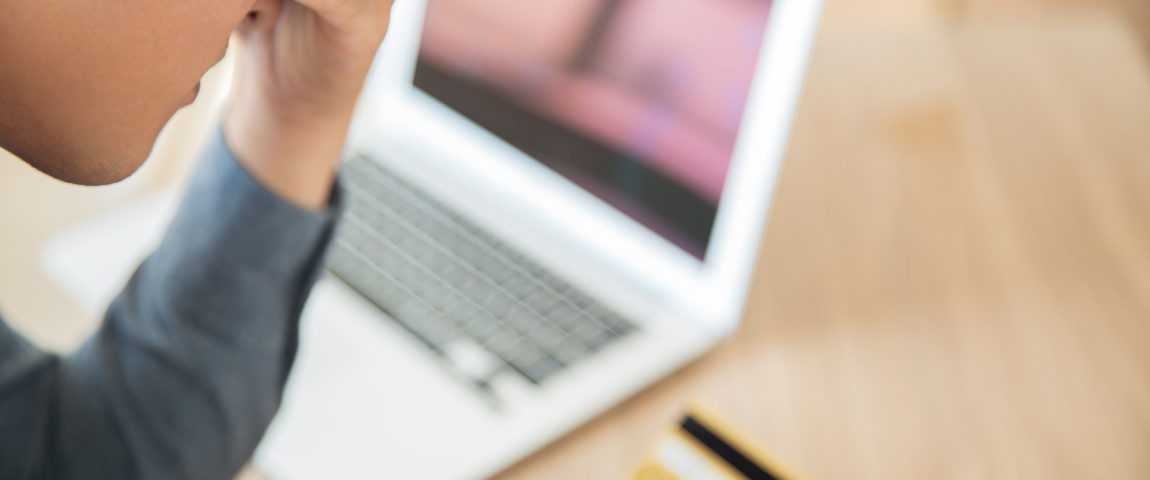 businessman-looking-at-credit-card